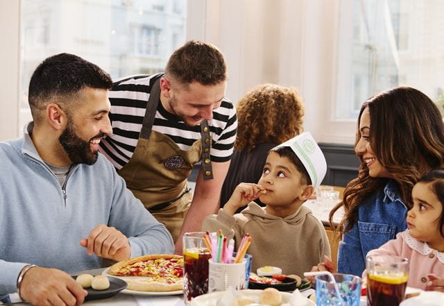 A family eating at pizza express